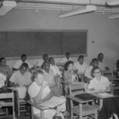 Classroom. Unidentified men and women seated at desks in classroom, ca. 1947. Paul Henderson, HEN.00.B2-250.