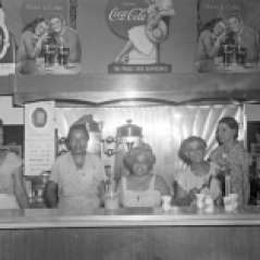 Women behind soda fountain lunch counter, circa 1950. Paul Henderson, HEN.00.B1-035.