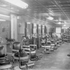 Interior of empty, unidentified barbershop, circa 1949. Paul Henderson, HEN.00.B1-114.