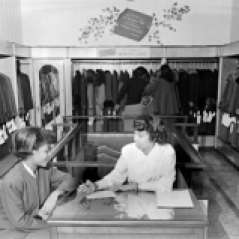 Interior of clothing store, circa 1949. Paul Henderson, HEN.00.B1-124.